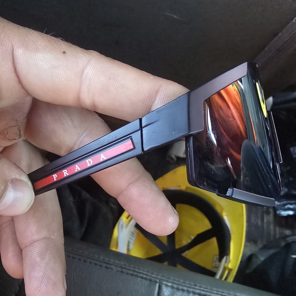 Prada Black Frame Sunglasses with Red Detail . They come with the box